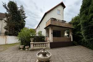 Vielseitiges Wohn- und Geschäftshaus mit großem Grundstück und Entwicklungspotenzial in Frankfurt... – 60437 Bonames, Frankfurt am Main – Vorschaubild 2