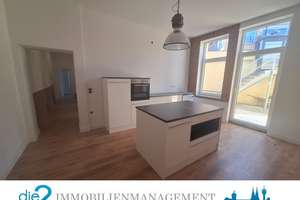Loft-Wohnung mit Wärmepumpe und Einbauküche in zentraler Lage zu vermieten.