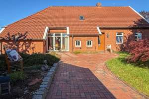 Ebenerdiges Wohnen mit Stil - gemütliches Einfamilienhaus auf großem Grundstück in zweiter Reihe – Die vollständige Adresse der Immobilie erhältst du vom Anbieter., 26624 Südbrookmerland – Vorschaubild 2