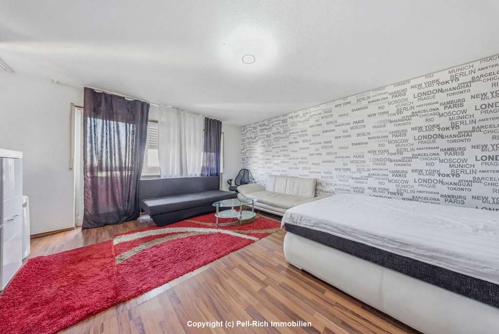 Immobilie in Karlsruhe - SMART INVEST: Vermietete 1-Zimmer-Wohnung mit Balkon, Garage und Kellerabteil in Karlsruhe-Neureut - Bild 1