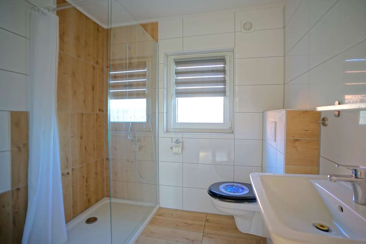 Immobilie in Schiffdorf - Volksbank Immobilien:
Einfamilienhaus mit Einliegerwohnung auf herrlichem Grundstück - Bild 11