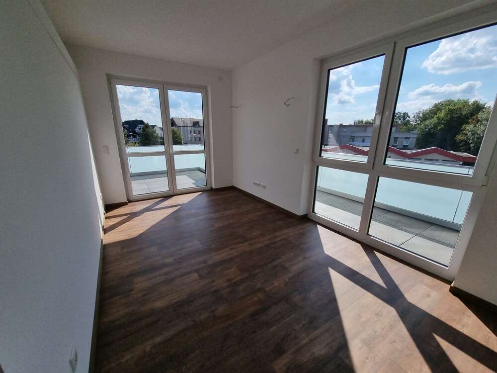 Immobilie in Lembruch - Wohnen, da wo andere Urlaub machen! KfW 55 Effizienzhaus - Penthouse-Eigentumswohnung mit großer Dac - Bild 1