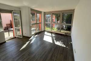 EG-Wohnung mit Terrasse, Gartenanteil & Tiefgaragenstellplatz