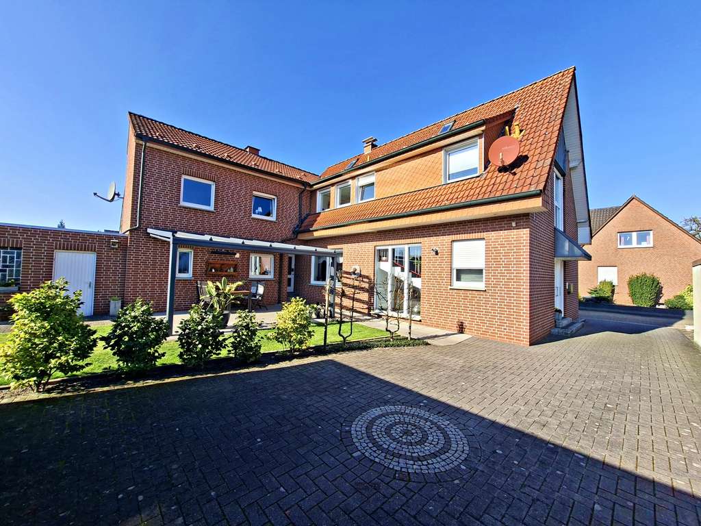 Immobilie in Rheine - Modernisiertes Zweifamilienhaus mit Doppelgarage und schönem Südgarten in Rheine-Eschendorf - Bild 2