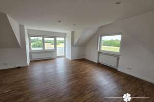 BERK Immobilien - Moderne 2-Zimmer-Dachgeschosswohnung mit Balkon in Feldrandlage von Mainhausen-Zel