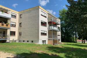 Großzügige 3,5-Zimmer-Erdgeschosswohnung mit Balkon, Gartenanteil & Garage