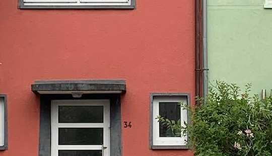 Bild von Ein Reihenhaus, das aus der Reihe tanzt