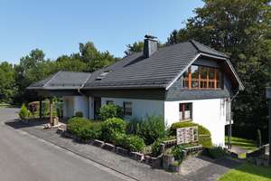 Gepflegtes Einfamilienhaus mit großem Studio, Garten und Garage in ruhiger Randlage – Die vollständige Adresse der Immobilie erhältst du vom Anbieter., 57290 Neunkirchen – Vorschaubild 1