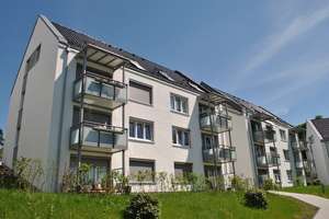 Untergeschosswohnung mit Terrasse / Aufzug / Einstellplatz