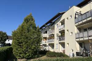 Attraktive Wohnung mit großzügigem Balkon und eigenem Tiefgaragenstellplatz