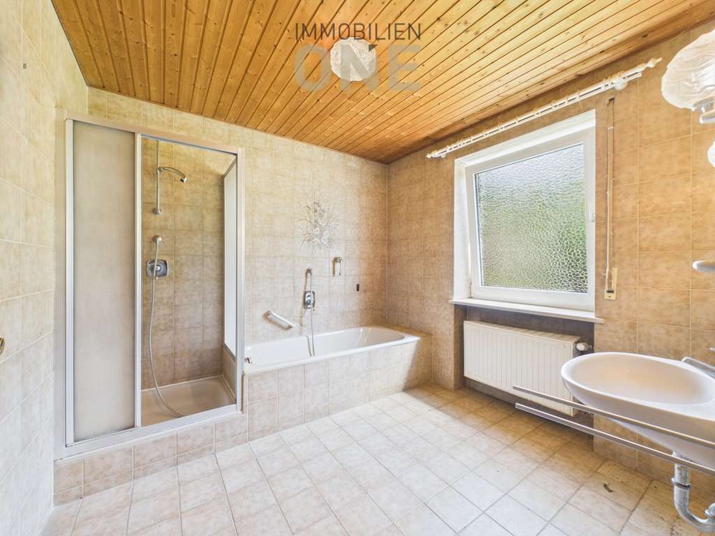 Immobilie in Nittendorf - 4-Zimmer Hochparterrewohnung mit Südterrasse und Garage - Bild 4