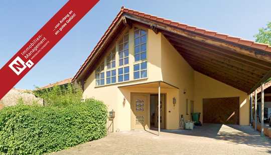 Bild von Architektonisch ansprechender Bungalow mit Wintergarten und Garage auf großzügigem Grundstück