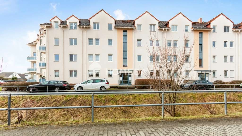 Immobilie in Borsdorf - Gepflegte Zwei-Zimmer-Wohnung mit Balkon und Tiefgaragenstellplatz - Bild 1