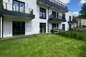 Großzügige Neubauwohnung mit Terrasse und Gartenanteil