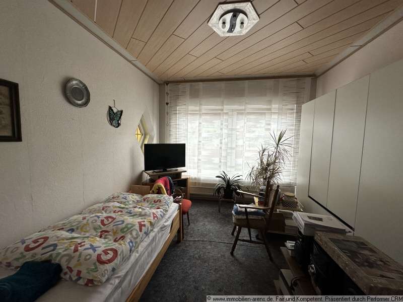 Immobilie in Apen - solides Klinkergebäude mit Garage und Wintergarten in Apen - Bild 2