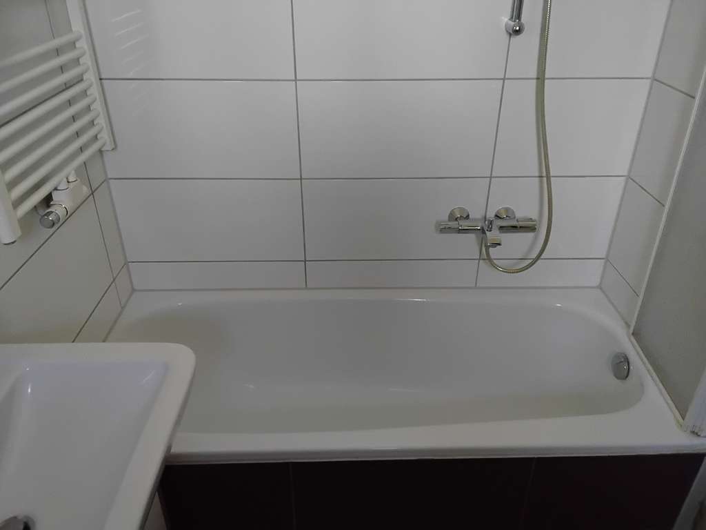 Immobilie in Gronau - Charmantes, vermietetes, teilweise renoviertes und modernisiertes Reihenendhaus mit Garage - Bild 4