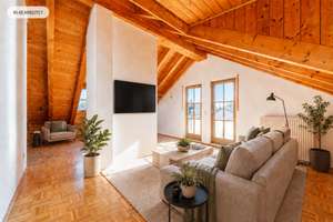 AIGNER - Großzügige Dachgeschosswohnung mit stilvollen Holzdetails