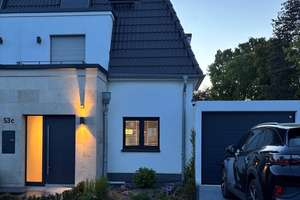 Stilvoller Neubau in begehrter Villenlage am Rhein – exklusive Doppelhaushälfte