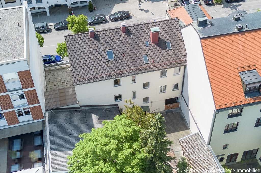 Wohn- und Geschäftshaus mit hohem Entwicklungspotenzial im Herzen von Planegg