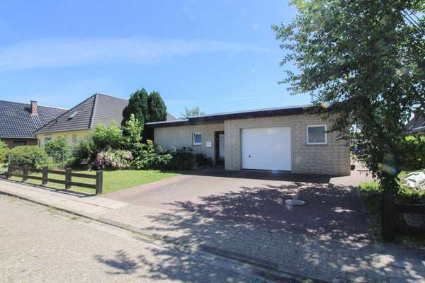 Ein Zuhause für die ganze Familie – gemütlicher Bungalow mit schönem Garten und Garage
