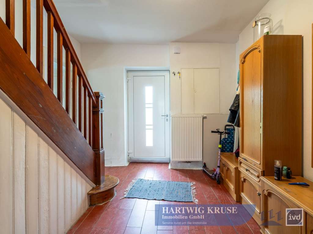 Immobilie in Drochtersen - Vermietetes Einfamilienhaus in ruhiger Lage mit großem Grundstück und Entwicklungspotenzial - Bild 3