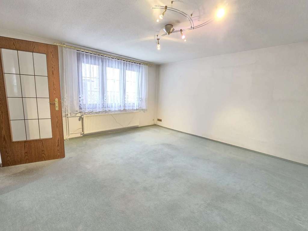 Immobilie in Barby - Charmantes Reihenmittelhaus mit Garage und Garten in ruhiger Lage von Barby - Bild 2