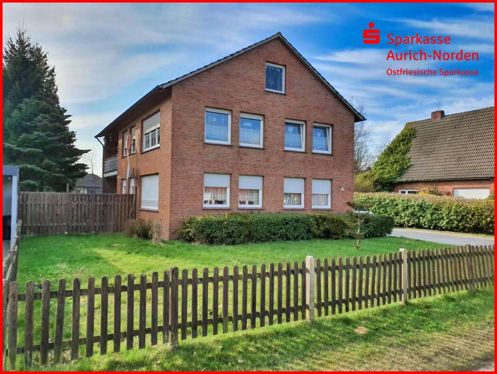 Immobilie in Wiesmoor - Vermietetes Zweifamilienhaus in zentraler Lage von Wiesmoor 
mit potentiellem Baugrundstück  - Bild 0