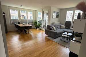 NEUBAU: 2 Zimmer verteilt auf 60 m² Wohnen + Balkon und Lift + Dachterrasse, inkl. großer TG-Stellpl – München – Vorschaubild 1