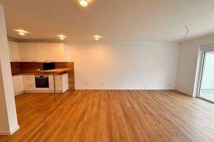Erstklassiges Investment: Vermietete 3,5-Zimmer-DG-Wohnung mit Aussichtsbalkon & KfW 40