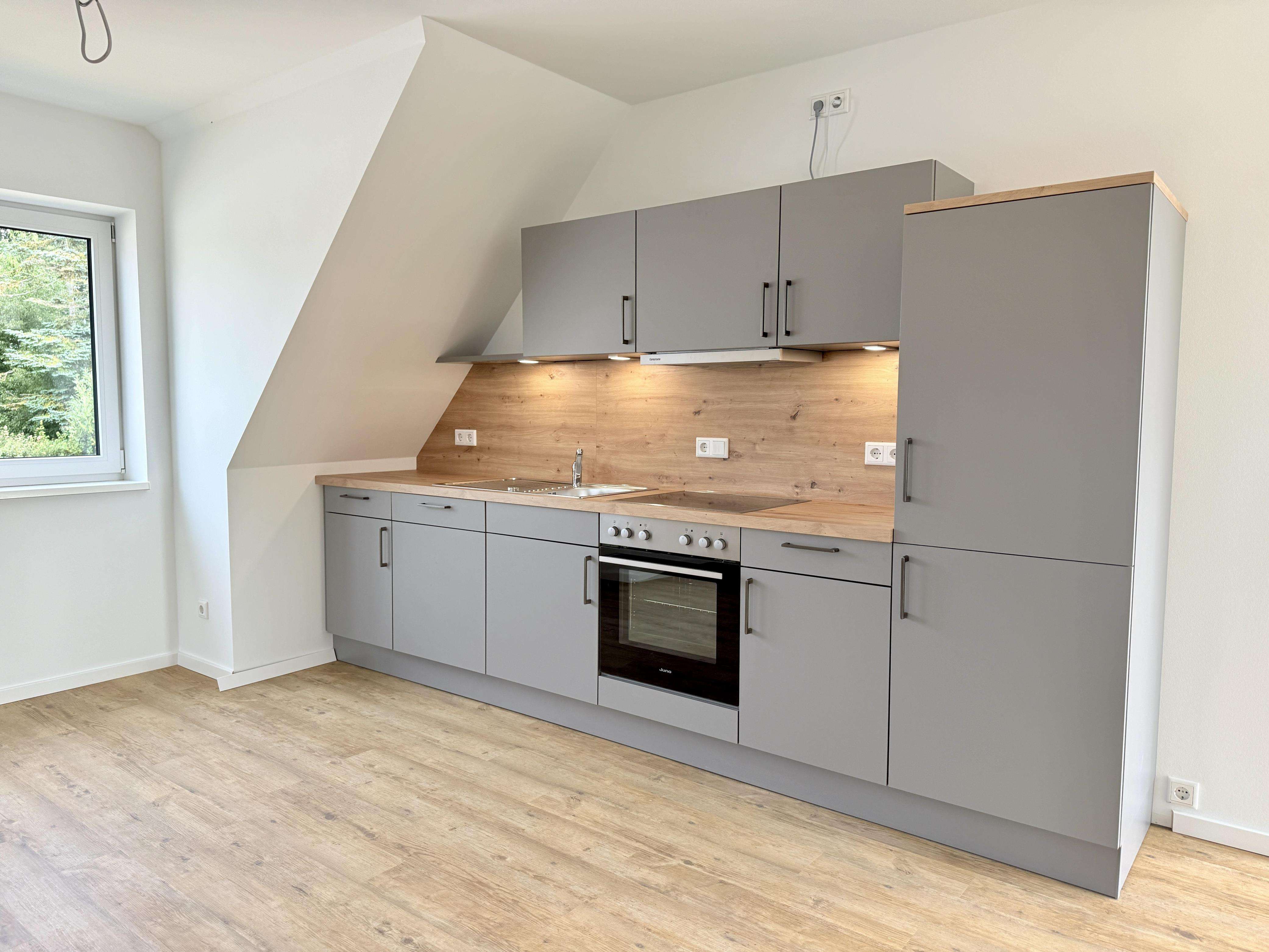 Immobilie in Breklum - ERSTBEZUG: Moderne 2-Zimmer Eigentumswohnung mit PKW-Stellplatz! -beziehen Sie Ihre eigene Etage- - Bild 1