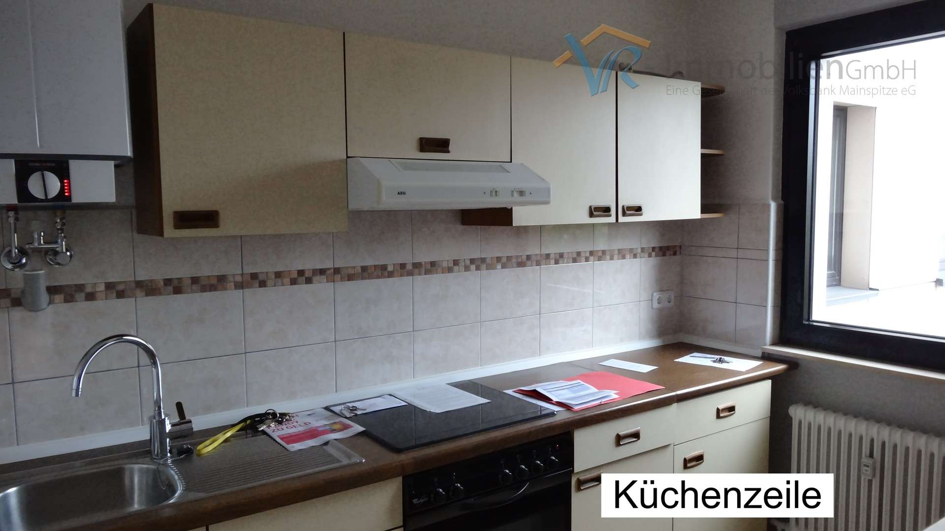 Immobilie in Ginsheim-Gustavsburg - Schicke vermietete 2 Zimmer-Wohnung in Ginsheim zum Verkauf - Bild 0