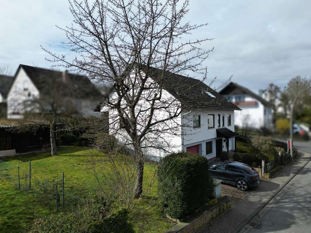 Immobilie in Marktheidenfeld - Ein Zuhause, das mit Ihrer Familie wächst – vielseitiges Einfamilienhaus mit Garten und separaten Wo - Bild 3