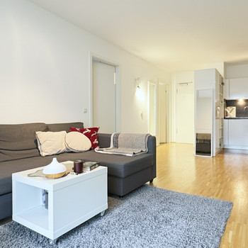 Vermietete Zwei-Zimmer-Eigentumswohnung mit kleinem Gartenanteil