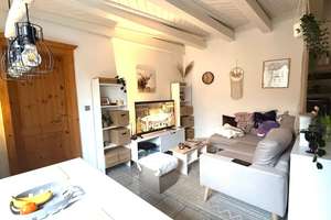 Charmante, vermietete 2-Zimmer-Wohnung im bungalowartigen Stil mit Terrasse, Gartenanteil und Garage