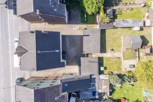 SOLL-Faktor 12! Laufend modernisiertes Mehrfamilienhaus mit 5 Garagen & Mietpotenzial