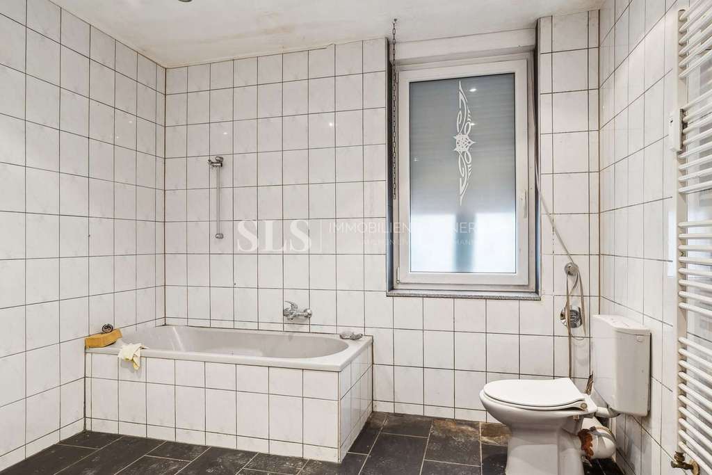 Immobilie in Dortmund - Dreifamilienhaus in Dortmund – laufende Mieteinnahmen und freie Erdgeschosswohnung mit Potenzial - Bild 1