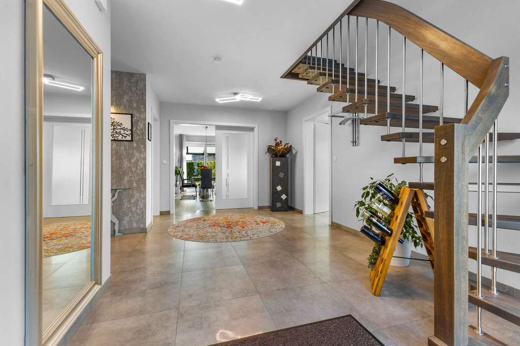 Immobilie in Rhede (Ems) - Seeblick, Ruhe, moderne Architektur – Traumhaus aus 2021 direkt am Spieksee - Bild 1