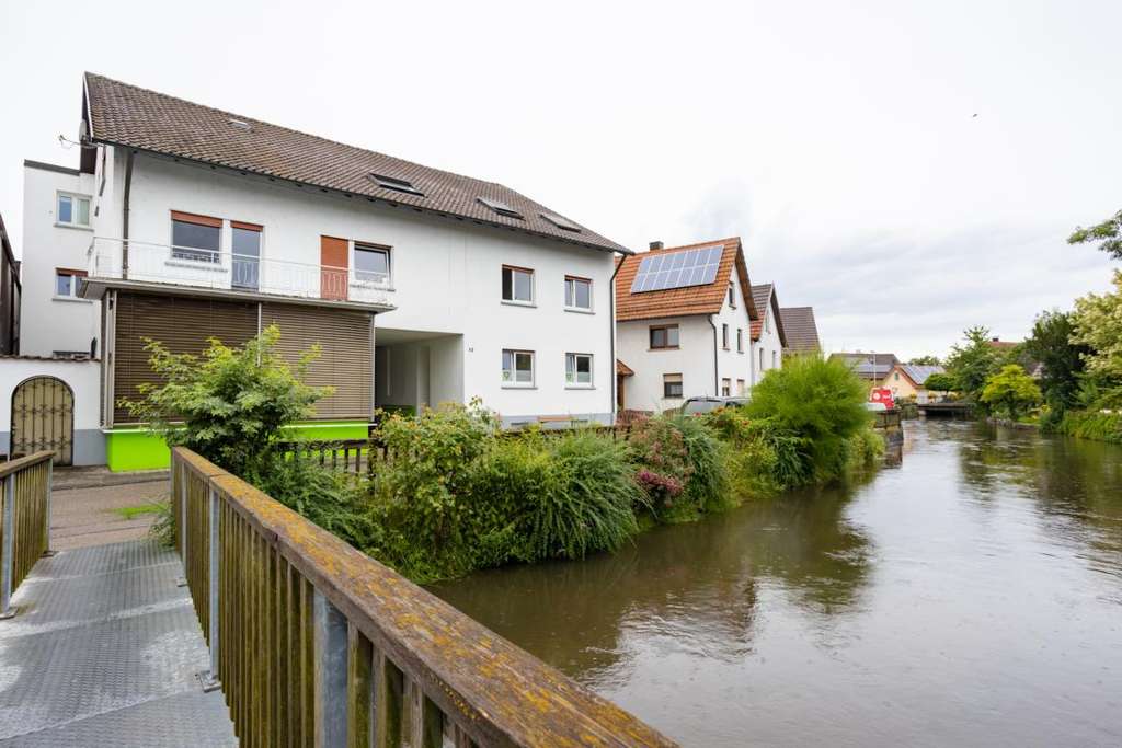 Immobilie in Rheinmünster - Wohn- und Geschäftshaus mit 3 Wohnungen, Gewerbeanteil und ca. 180 m² Lager - Bild 1