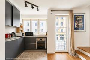 AIGNER - Mitten in der Maxvorstadt: Helle 2-Zimmer-Wohnung mit Westbalkon