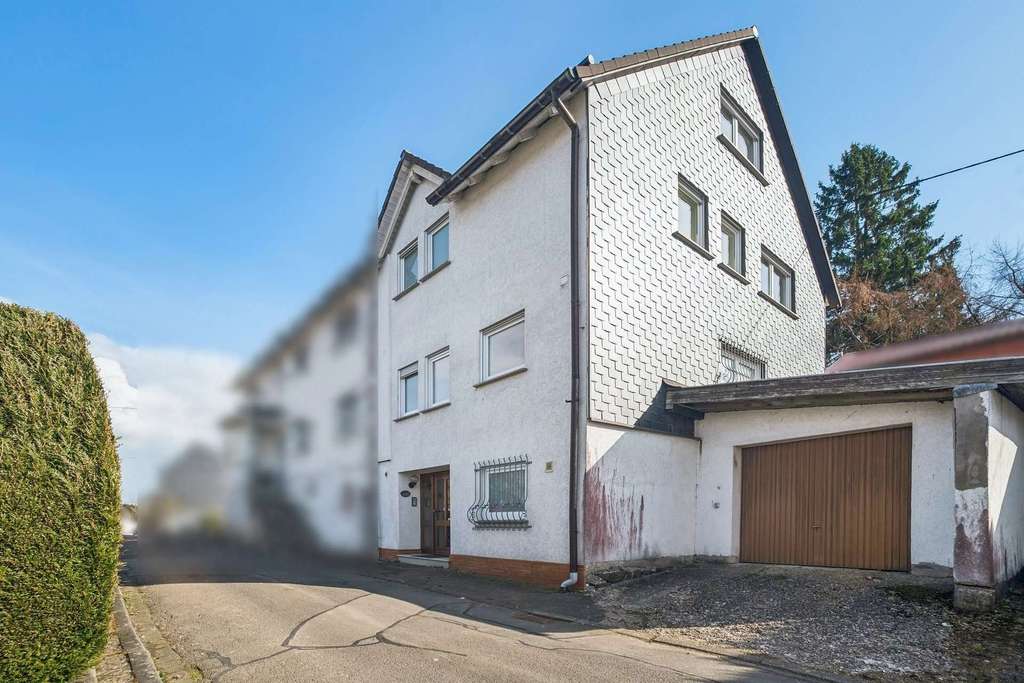 Immobilie in Hellenhahn-Schellenberg - Modernisierte DHH mit Garten als WEG geteilt - mit neuen Fenstern und einem neuem Kaminofen!! - Bild 0