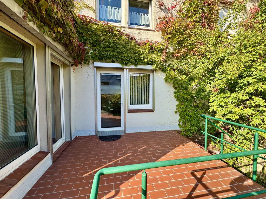 Immobilie in Stolzenau - Zweifamilienhaus mit einer Praxis, einer Wohneinheit und einem idyllischen Garten in Stolzenau! - Bild 1