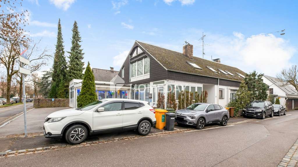 Immobilie in Augsburg - Großzügiges Einfamilienhaus mit Einliegerwohnung und gut vermieteter Gewerbeeinheit! - Bild 1