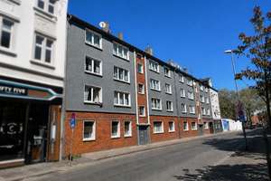 Mehrfamilienhäuser mit 16 Wohneinheiten und​  Gewerbeflächen