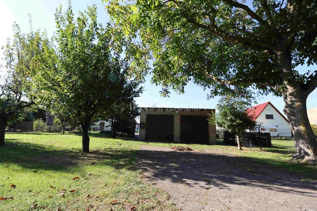 Immobilie in Laage - Provisionsfrei - Einfamilienhaus mit Ausbaumöglichkeit, Garage & Bauland! - Bild 3