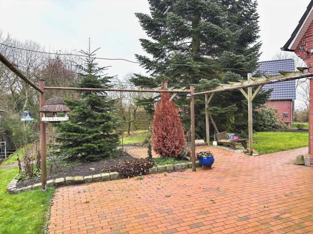 Immobilie in Hinte - Einfamilienhaus mit Garage in Sackgassenlage von Hinte-Loppersum - Bild 1