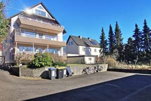Freistehendes Mehrfamilienhaus mit Garagenhof in BN-Plittersdorf
