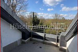 Helle Dachgeschosswohnung mit großer Sonnenterrasse & Garage in gepflegtem Mehrfamilienhaus