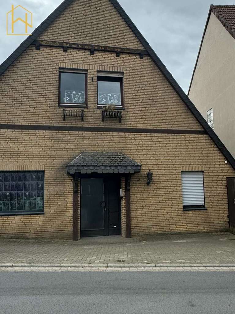 Immobilie in Melle - Solides Zweifamilienhaus mit gesicherten Mieteinnahmen und Eigennutzungspotenzial - Bild 1