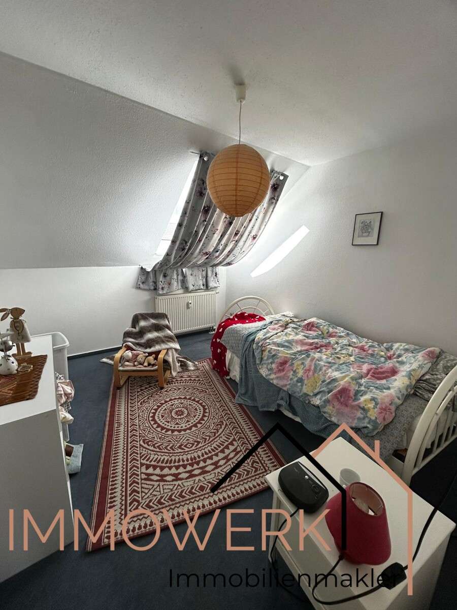 Immobilie in Luhden - Schön geschnittene, voll vermietete DG-Wohnung mit Balkon und Stellplatz. - Bild 1