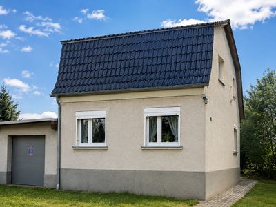 Modernisiertes Einfamilienhaus mit viel Nutzfläche, Garten und Autowerkstattpotenzial